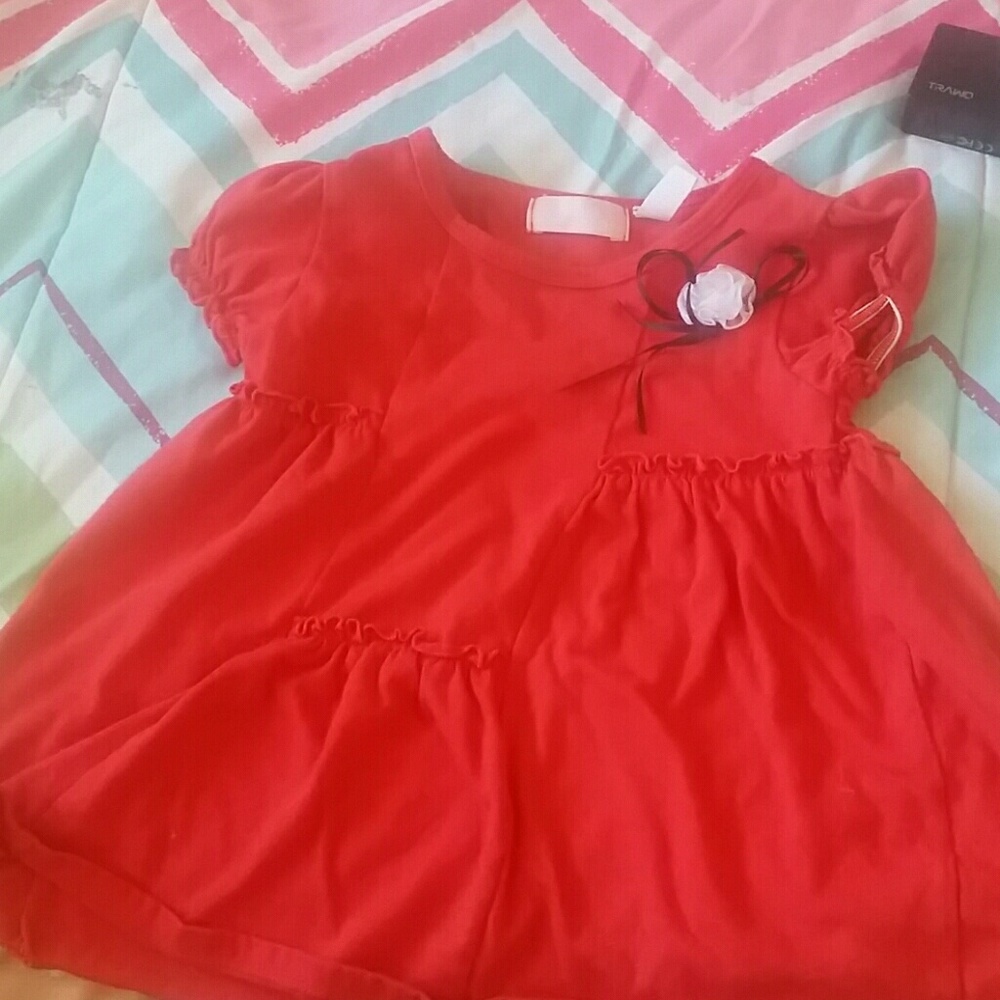 A little girl red top
